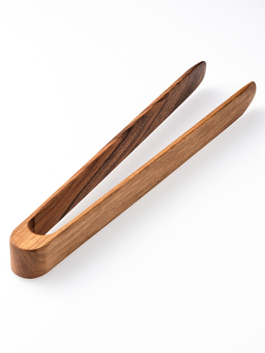 Pince de cuisine design et artisanale en noyer massif